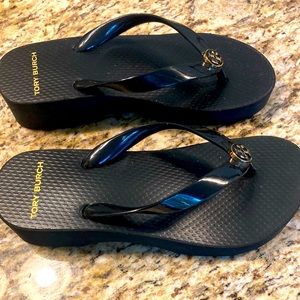 Like New Tory Burch black wedge flip flops.